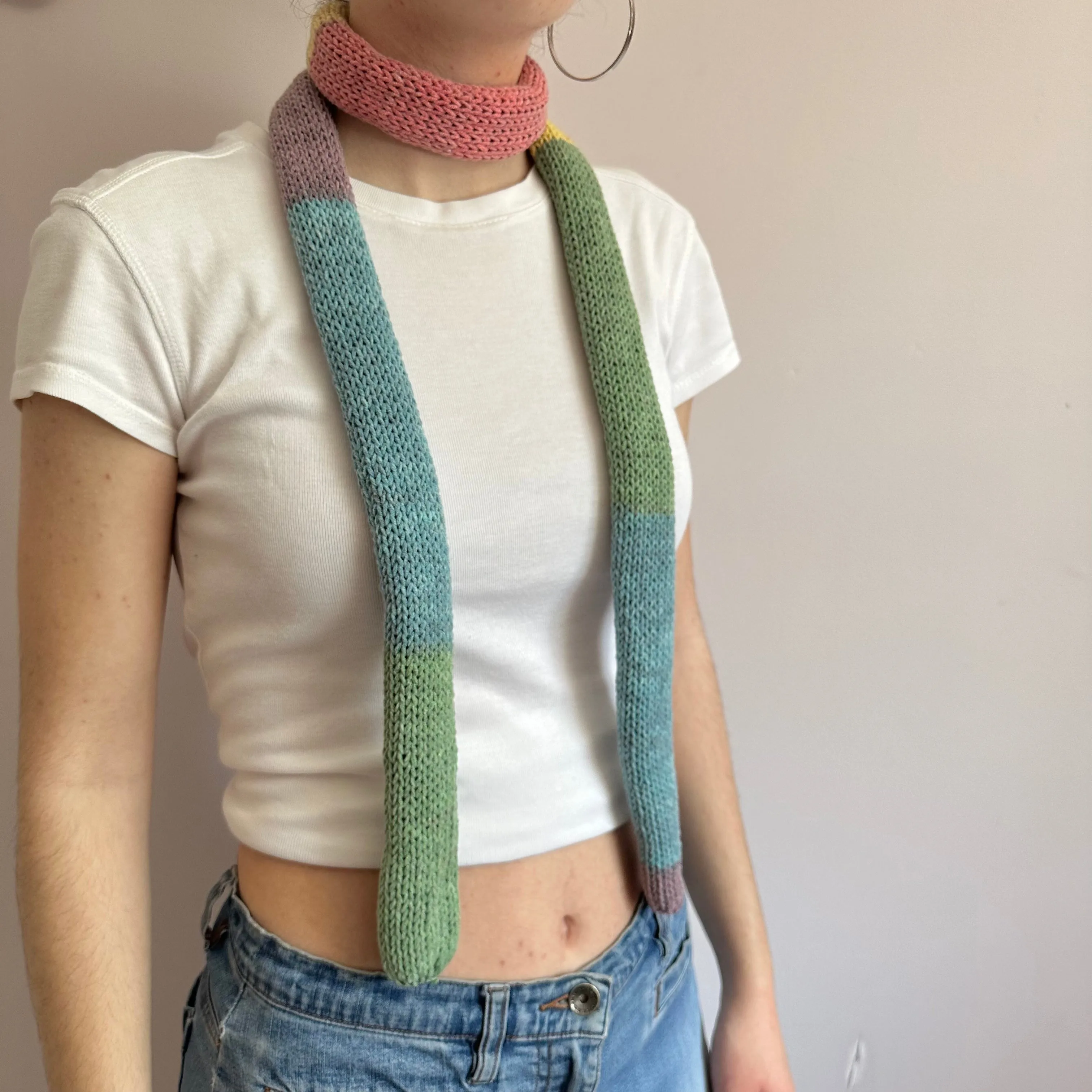 Handmade knitted colour block skinny scarf in dusky rainbow